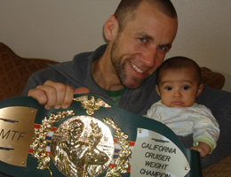 Dave Nielsen WCK World Championship Muay Thai IAMTF California Cruiserweight Title belt with daughter.